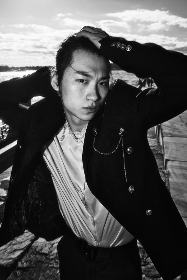 B&W editorial portrait, direct gaze, outdoor
